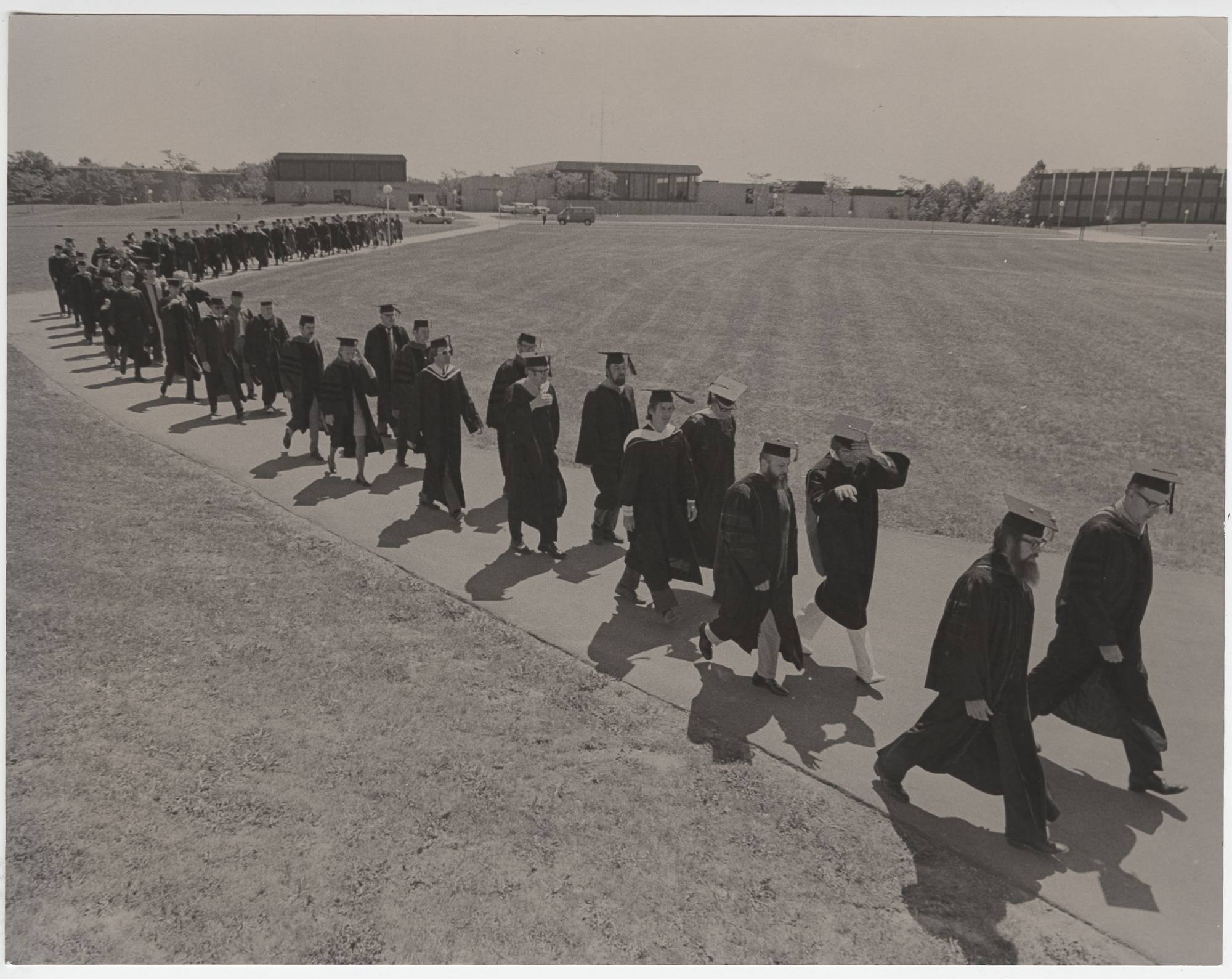 Grads walking to commencememt